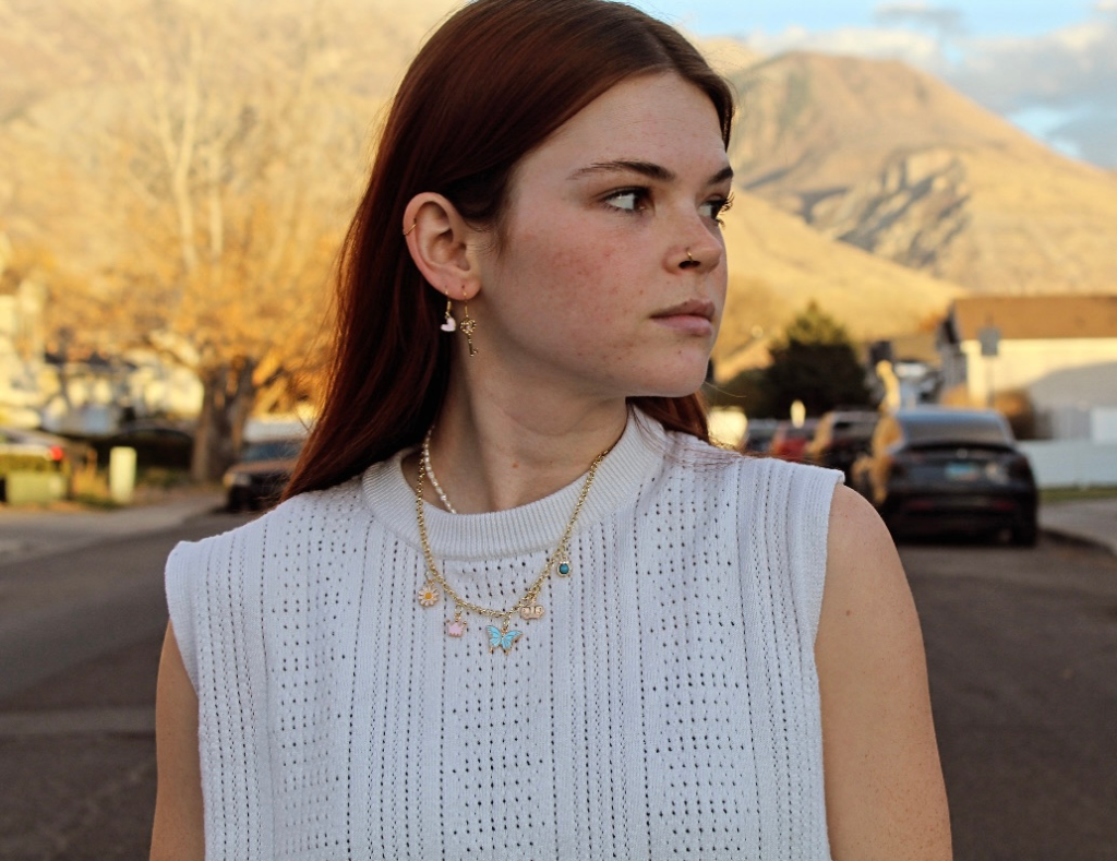 Contact section for Jewelry by Brook. Left side includes a photo of the designer and a paragraph inviting custom design inquiries. Right side shows a standard contact form for name, email, and messages.